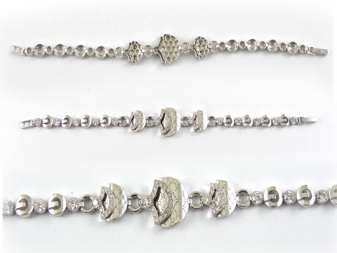 браслеты  из белого золота с брилиантами ( возможно в серебре с церконами )